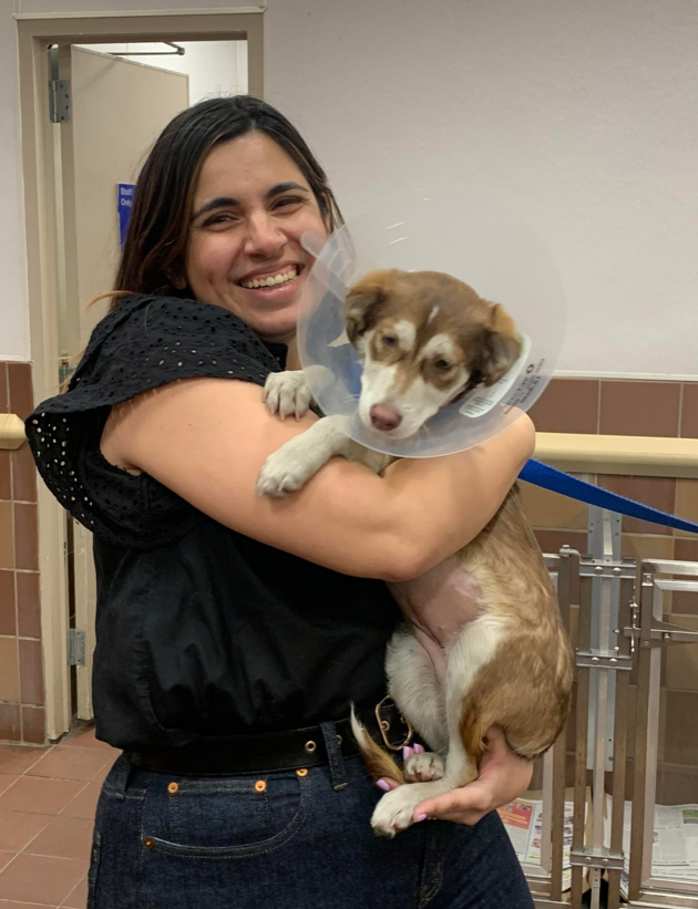 Alexsis holding the dog at the shelter